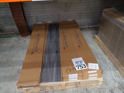 a stack of boxes sitting on the floor in a warehouse