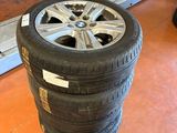 a tire that is sitting on the floor next to some other tires