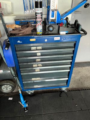 a blue tool cart with a lot of tools on it