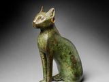 an egyptian bronze figure of a cat