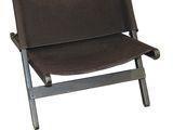 a brown chair that is sitting on a white background