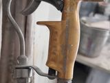 a spray gun that is attached to a wall