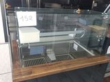 a glass case with a number on it in a store