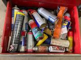 a red box filled with cans and cans of soda