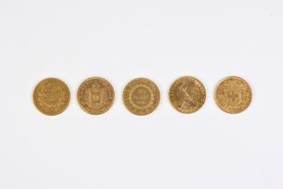 four different types of gold coins on a white surface
