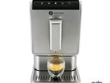 an image of a coffee machine with a cup of coffee in it