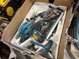 a box of tools that are sitting on the floor