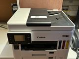 a printer that is sitting on top of a cabinet