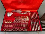 a red case with silverware in it on a table
