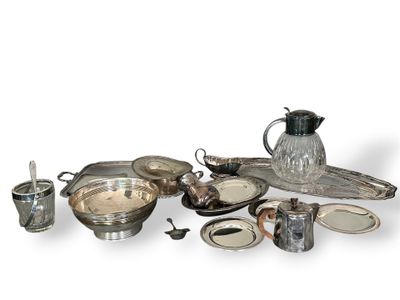 a silver plate with a pitcher on top of it