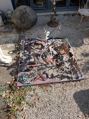 a rug on the ground in front of a building