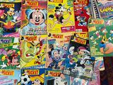 a lot of comic books that are on the table