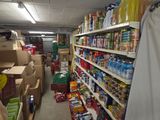 a large amount of food on the shelves in the store