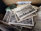 a box full of old photos and old postcards