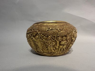 gold plated bowl with a scene of a man and a woman in a garden