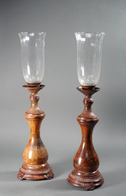 pair of antique wooden candlesticks with glass holders