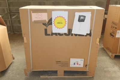 a cardboard box with a sticker on it sitting on a pallet