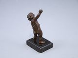 antique bronze figurine of a boy on a marble base