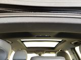 a view of the sunroof of a car from inside the vehicle