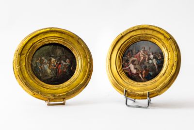 pair of paintings of a man and a woman in a gold frame