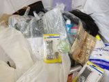 a basket full of items that are sitting on a bed
