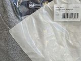a bag of clothing sitting on the floor in the store