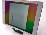 an image of a tablet computer sitting on top of a white table