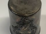 an old metal container sitting on top of a white surface