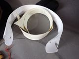a pair of scissors and tape on the seat of a car