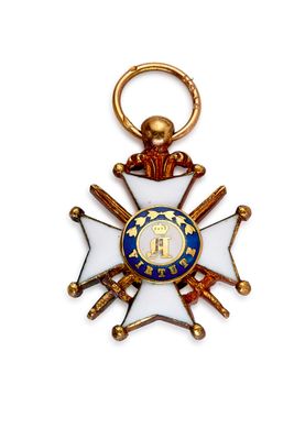 gros plan d'une médaille sur fond blanc