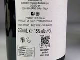 a bottle of wine sitting on a table with a label on it