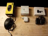 a computer mouse and other electronics sitting on a table