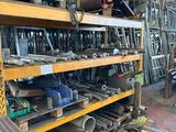 many different types of tools on the shelves in the shop
