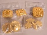 two bags of gold colored metal buttons and a pair of gold colored metal buttons