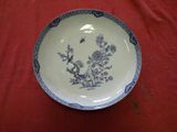 a blue and white plate on a red table cloth