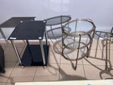 a glass table and two chairs in a room