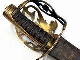 a close up of a knife with a handle on it