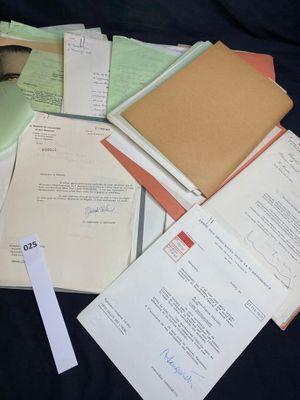 a pile of papers sitting on top of a black table