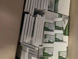 boxes of cigarettes are stacked on top of each other on a shelf