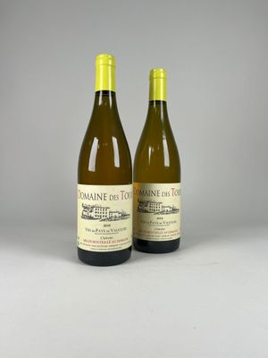 two bottles of wine sitting next to each other on a table