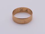an image of a gold wedding ring with the words mr and mrs engraved on it