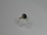 a close up of a ring on a white surface