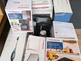 many boxes of kitchen appliances sitting on a table