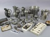 a lot of silver items that are on the table