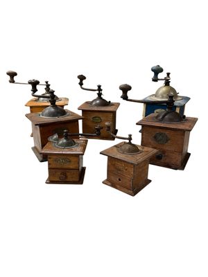 four different types of coffee grinders are shown on a white background