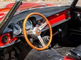 a red and black car with a steering wheel and dashboard