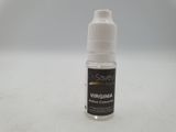 a close up of a bottle of liquid sitting on a table