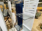 many shelves that are in the middle of a room