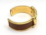 gold plated cuff bracelet with brown leather band and brass clasp