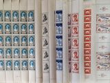 a lot of stamps that are on the wall